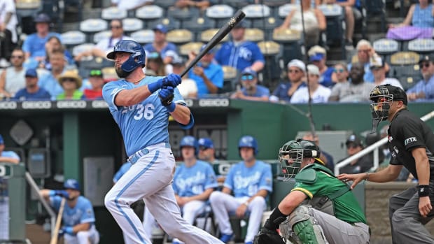 Jun 25, 2022; Kansas City, Missouri, USA; Kansas City Royals catcher Cam Gallagher (36) hits an RBI double during the sixth inning against the Oakland Athletics at Kauffman Stadium. Mandatory Credit: Peter Aiken-USA TODAY Sports